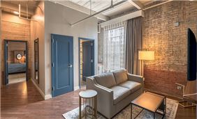Find ample space in our Mill Suite, equipped with a living area and pull out sleeper sofa, and separate bedroom with queen bed